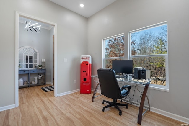 office space featuring a chandelier, recessed lighting, baseboards, and light wood finished floors