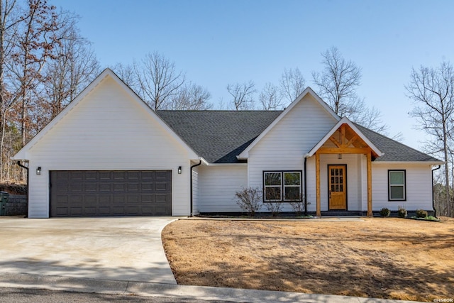 modern farmhouse with a garage, concrete driveway, and roof with shingles