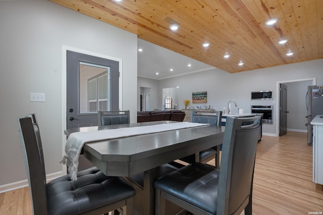 dining space featuring recessed lighting, light wood-style flooring, ornamental molding, wood ceiling, and baseboards