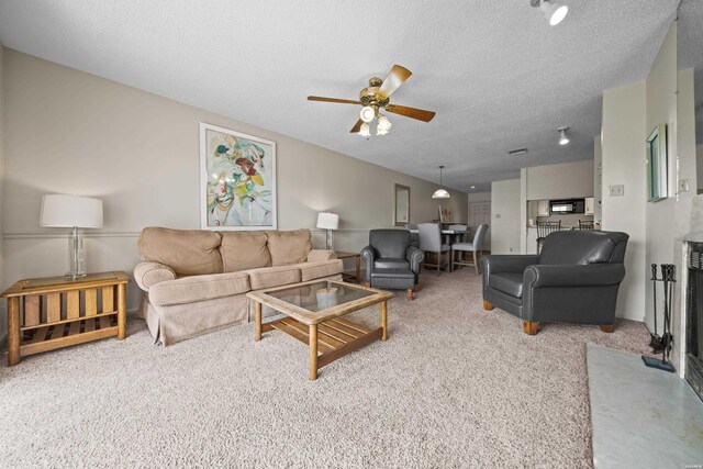 5371 Central Ave Unit 6H, Hot Springs, AR 71913 - carpeted living area with a ceiling fan and a textured ceiling