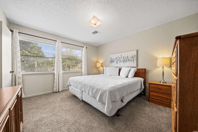 5371 Central Ave Unit 6H, Hot Springs, AR 71913 - bedroom featuring light colored carpet and a textured ceiling