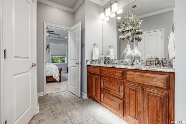 full bath featuring double vanity, visible vents, ornamental molding, a sink, and ensuite bath