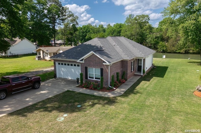 ranch-style home with a garage, driveway, brick siding, and a front yard