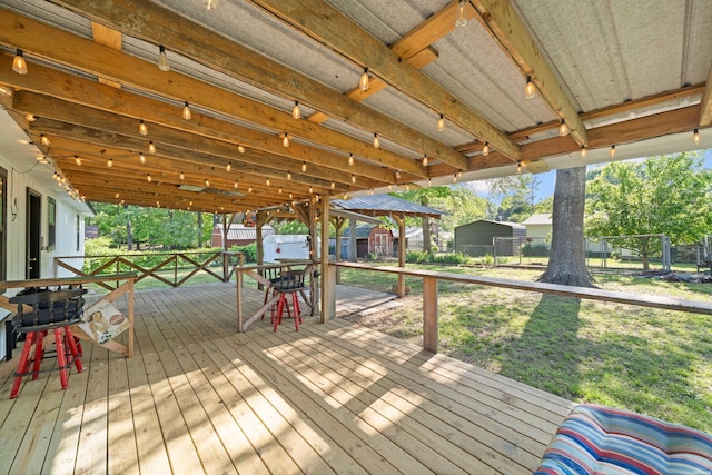 711 S Red St, Sheridan, AR 72150 - wooden terrace featuring fence and a lawn