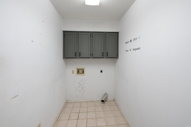 711 S Red St, Sheridan, AR 72150 - clothes washing area with hookup for a washing machine, a textured ceiling, electric dryer hookup, cabinet space, and baseboards