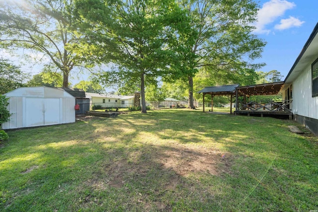 711 S Red St, Sheridan, AR 72150 - view of yard featuring a fenced backyard, an outbuilding, and a storage shed