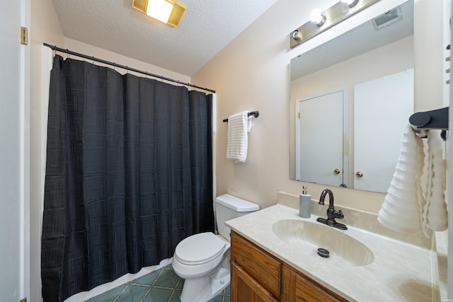 711 S Red St, Sheridan, AR 72150 - bathroom featuring a textured ceiling, toilet, visible vents, tile patterned flooring, and vanity