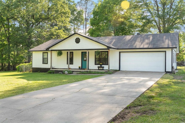 711 S Red St, Sheridan, AR 72150 - single story home featuring an attached garage, driveway, a porch, and a front yard