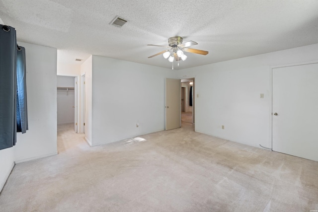 711 S Red St, Sheridan, AR 72150 - empty room with ceiling fan, carpet flooring, a textured ceiling, and visible vents