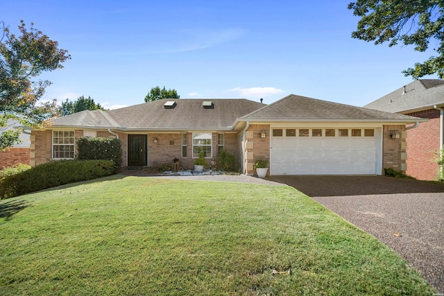 single story home with aphalt driveway, brick siding, a shingled roof, an attached garage, and a front yard