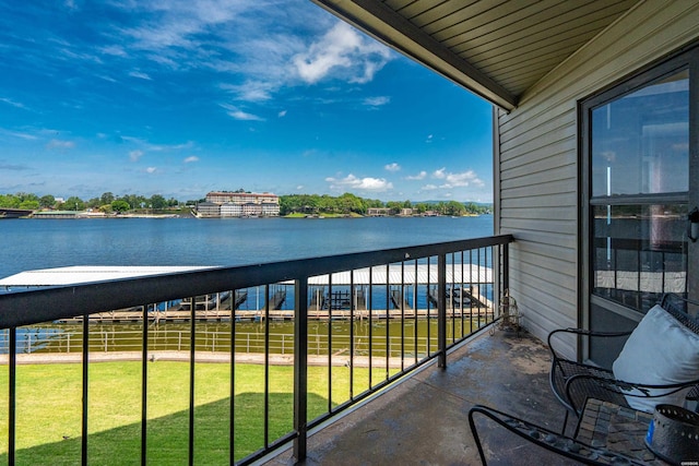 balcony featuring a water view