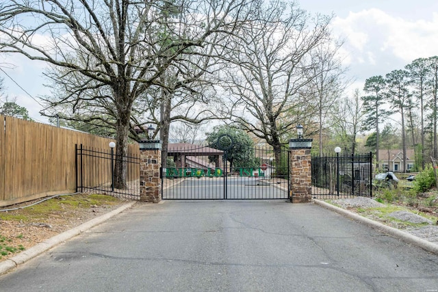 view of gate with fence