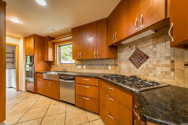 415 Gold Nugget Loop, Hot Springs, AR 71913 - kitchen featuring appliances with stainless steel finishes, light tile patterned floors, tasteful backsplash, brown cabinets, and recessed lighting