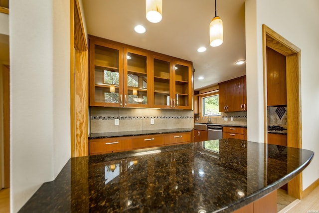 415 Gold Nugget Loop, Hot Springs, AR 71913 - kitchen featuring dishwasher, brown cabinets, recessed lighting, tasteful backsplash, and glass insert cabinets