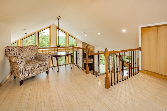 415 Gold Nugget Loop, Hot Springs, AR 71913 - living area with wood finished floors, lofted ceiling, an upstairs landing, and recessed lighting