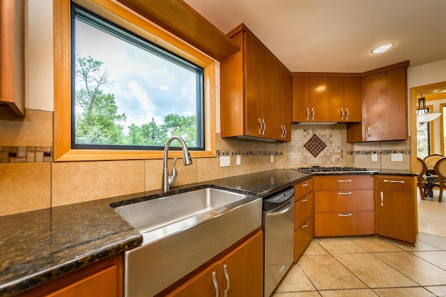 415 Gold Nugget Loop, Hot Springs, AR 71913 - kitchen featuring stainless steel appliances, tasteful backsplash, light tile patterned floors, and dark stone counters
