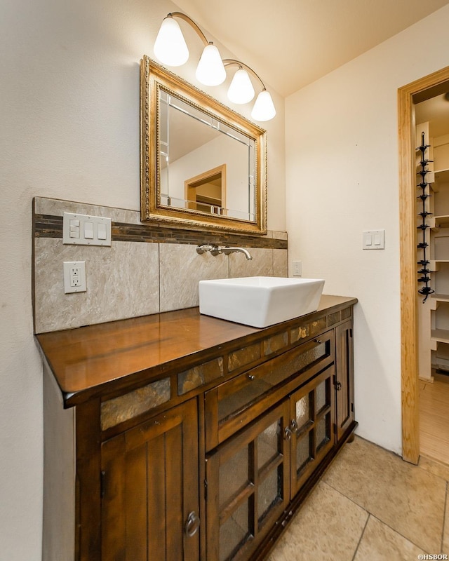 415 Gold Nugget Loop, Hot Springs, AR 71913 - bathroom featuring vanity, tile patterned floors, and decorative backsplash