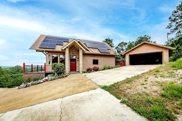415 Gold Nugget Loop, Hot Springs, AR 71913 - view of front of home with roof mounted solar panels, a shingled roof, and a garage