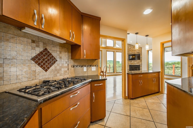 415 Gold Nugget Loop, Hot Springs, AR 71913 - kitchen featuring healthy amount of natural light, tasteful backsplash, a stone fireplace, stainless steel gas cooktop, and recessed lighting