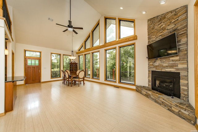 415 Gold Nugget Loop, Hot Springs, AR 71913 - living area with a ceiling fan, a stone fireplace, high vaulted ceiling, light wood-type flooring, and recessed lighting
