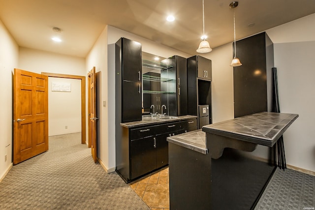 415 Gold Nugget Loop, Hot Springs, AR 71913 - kitchen featuring tile countertops, light colored carpet, pendant lighting, dark cabinetry, and recessed lighting