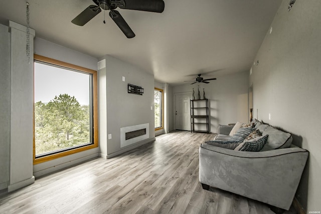 415 Gold Nugget Loop, Hot Springs, AR 71913 - living room featuring ceiling fan, wood finished floors, and a fireplace