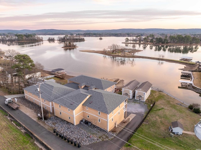 aerial view at dusk with a water view