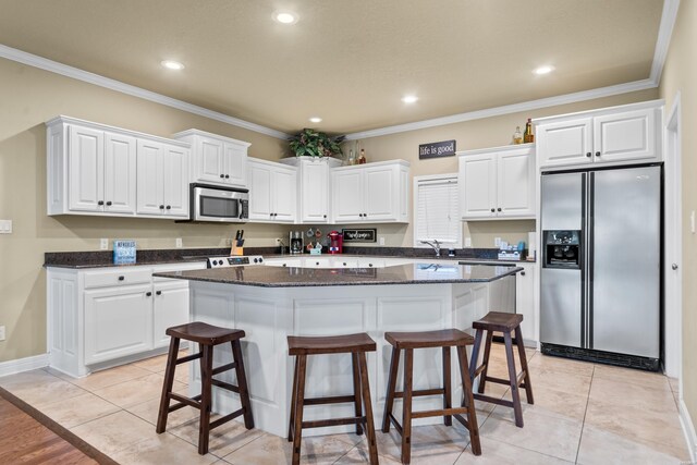 141 Central Ter Unit B, Hot Springs, AR 71913 - kitchen featuring ornamental molding, appliances with stainless steel finishes, a kitchen island, and white cabinetry