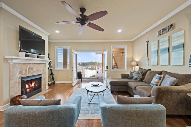 141 Central Ter Unit B, Hot Springs, AR 71913 - living room with ornamental molding, a tiled fireplace, wood finished floors, and baseboards