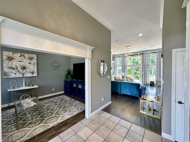 living area featuring wood tiled floor and baseboards