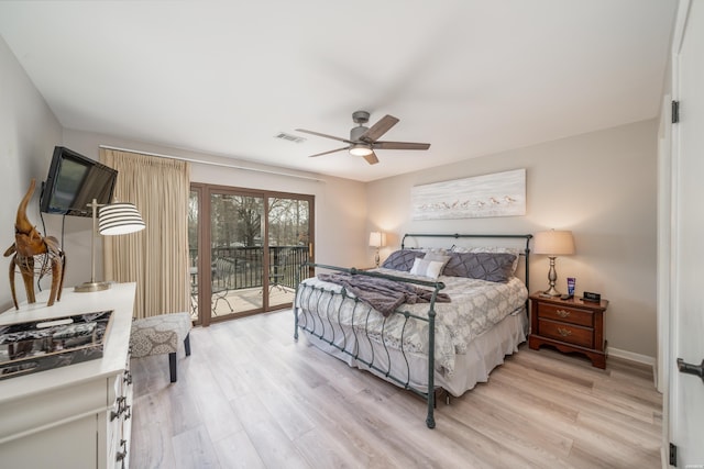 bedroom with access to outside, light wood finished floors, visible vents, and a ceiling fan