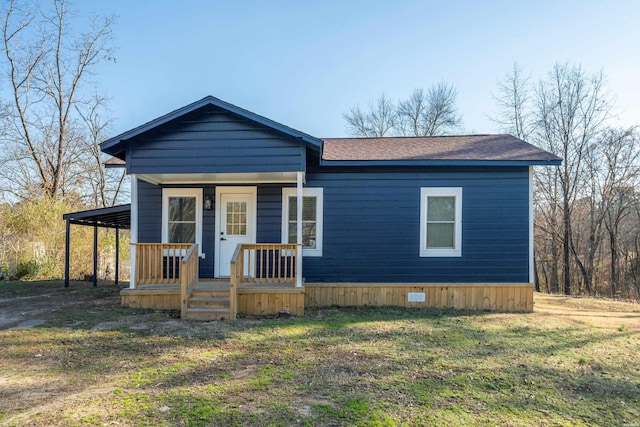 manufactured / mobile home with a porch and a shingled roof