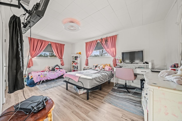 bedroom with wood finished floors