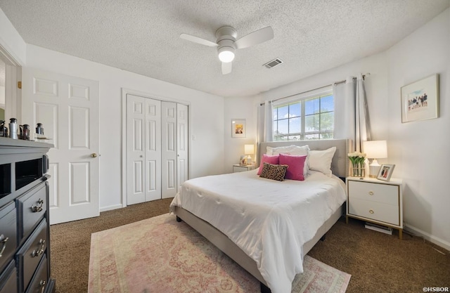 200 Cole Pl, Hot Springs, AR 71901 - bedroom with a textured ceiling, dark carpet, a closet, and a ceiling fan