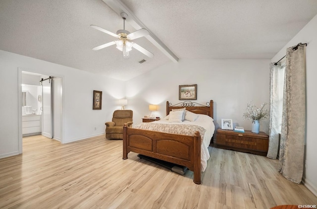 200 Cole Pl, Hot Springs, AR 71901 - bedroom with light wood finished floors, a textured ceiling, a ceiling fan, and connected bathroom