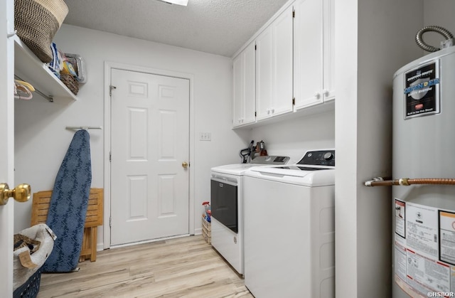 200 Cole Pl, Hot Springs, AR 71901 - laundry area with gas water heater, independent washer and dryer, cabinet space, light wood-style floors, and a textured ceiling