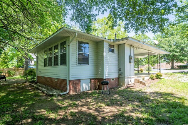 view of home's exterior featuring fence and crawl space