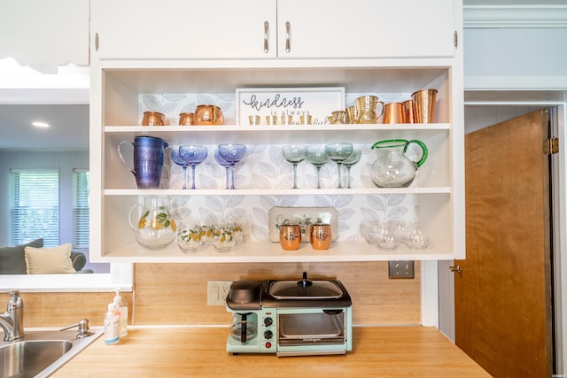 pantry with a toaster and a sink