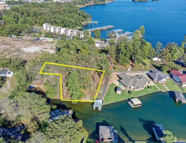 birds eye view of property featuring a water view and a residential view