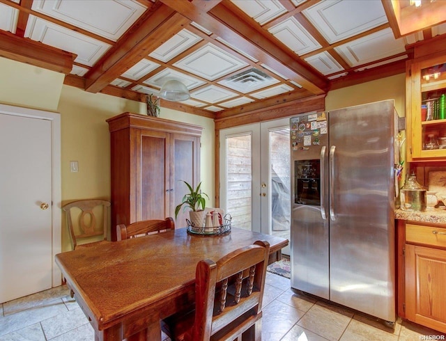 dining space featuring an ornate ceiling, french doors, and coffered ceiling