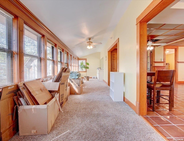 interior space featuring vaulted ceiling and a ceiling fan