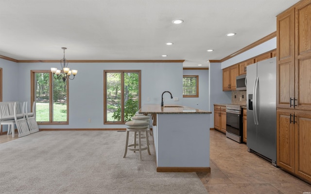 5 Arga Pl, Hot Springs, AR 71909 - kitchen featuring appliances with stainless steel finishes, crown molding, a kitchen breakfast bar, light stone counters, and recessed lighting