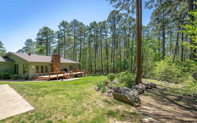 5 Arga Pl, Hot Springs, AR 71909 - view of green lawn with a deck, french doors, and a forest view