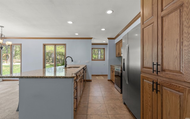 5 Arga Pl, Hot Springs, AR 71909 - kitchen with stainless steel appliances, ornamental molding, stone countertops, brown cabinets, and recessed lighting