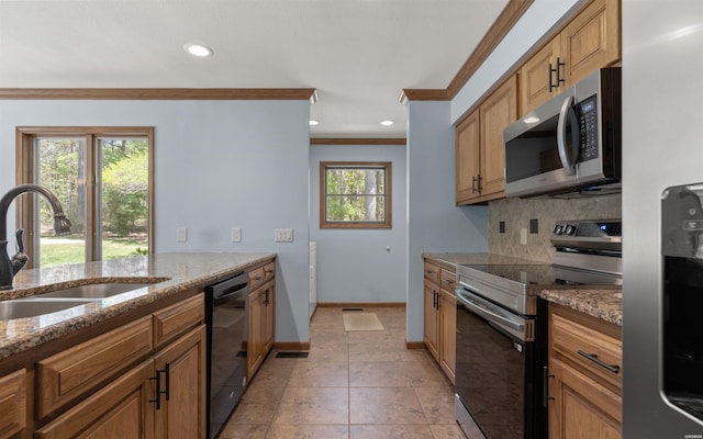 5 Arga Pl, Hot Springs, AR 71909 - kitchen with appliances with stainless steel finishes, crown molding, decorative backsplash, light stone counters, and brown cabinets