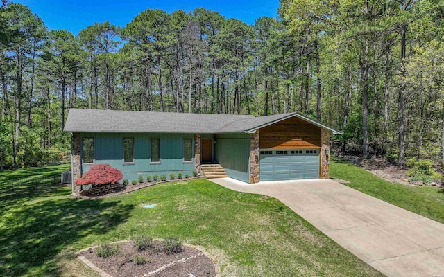 5 Arga Pl, Hot Springs, AR 71909 - view of front of house featuring a garage, concrete driveway, a front lawn, and stone siding