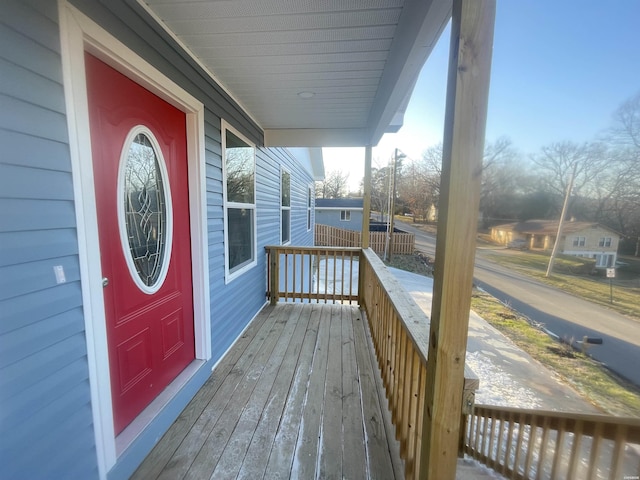 wooden deck featuring covered porch