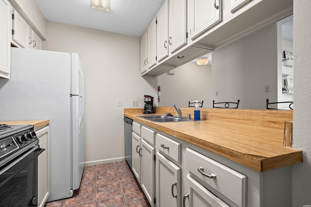 5371 Central Ave Unit 6E, Hot Springs, AR 71913 - kitchen with black range oven, wood counters, dishwasher, white cabinetry, and dark tile patterned flooring