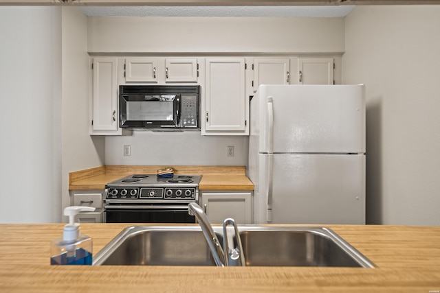 5371 Central Ave Unit 6E, Hot Springs, AR 71913 - kitchen with black appliances and white cabinets