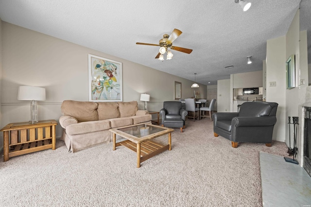 5371 Central Ave Unit 6E, Hot Springs, AR 71913 - carpeted living area with a ceiling fan and a textured ceiling
